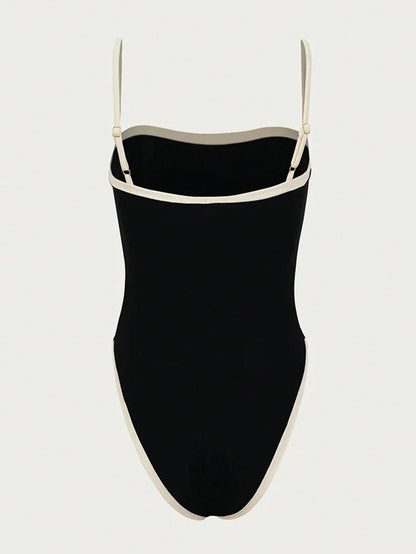 Maillot de bain femme noir élégant avec décolleté et détails contrastés