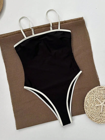 Maillot de bain femme noir élégant avec décolleté et détails contrastés