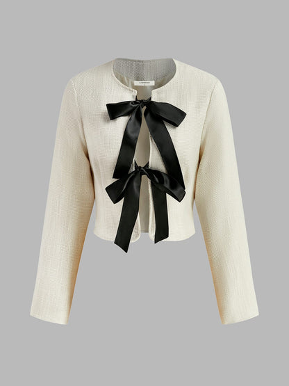 Blazer Tweed Blanc Élégant avec Nœud en Satin Noir - BerlinGlamour