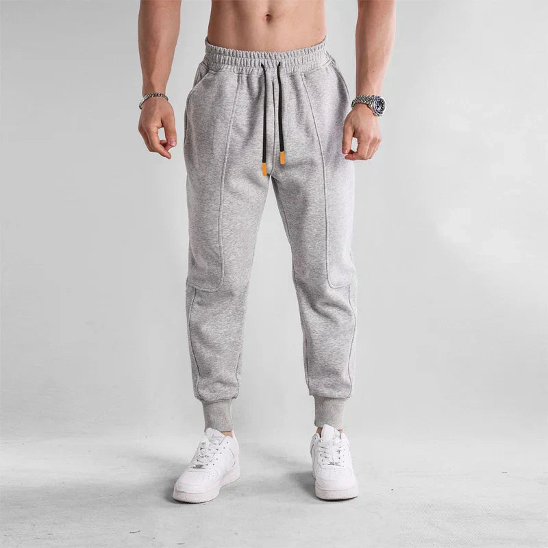 Pantalon de sport homme noir confortable avec poches latérales