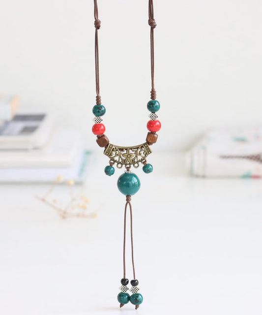 Pendentif en bronze cuivré avec pompon céramique tressée - EasyApparels