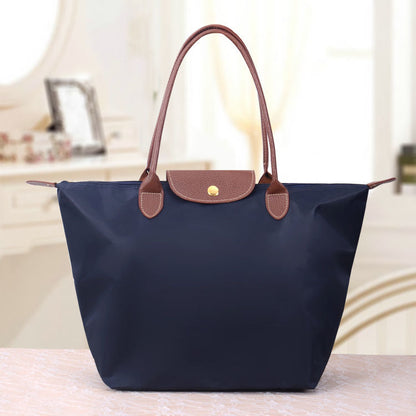 Sac à main en toile noir avec poignées en cuir brun