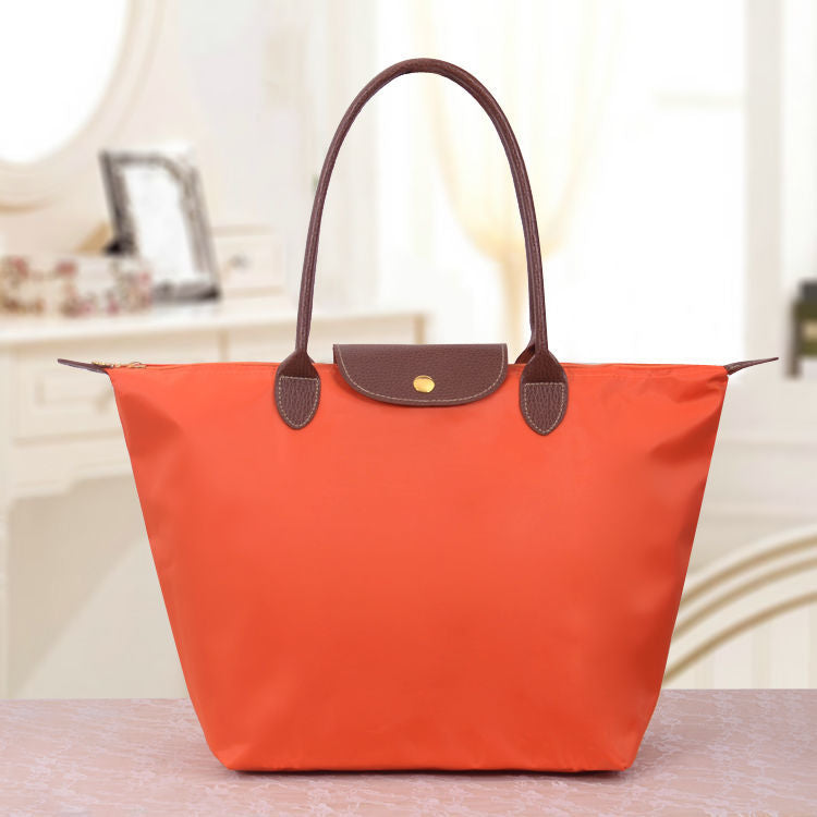 Sac à main en toile noir avec poignées en cuir brun
